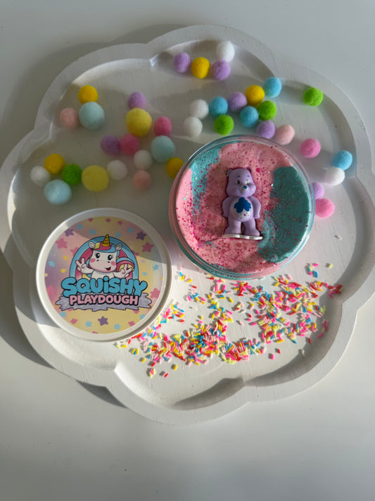 Pastel blue and pink playdough with a Care Bears Figurine