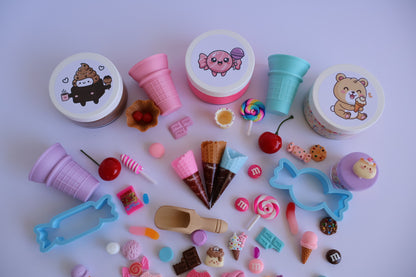 Colorful playdough tubs decorated with sprinkles and dessert charms from the Sweet Treats Playdough Kit 